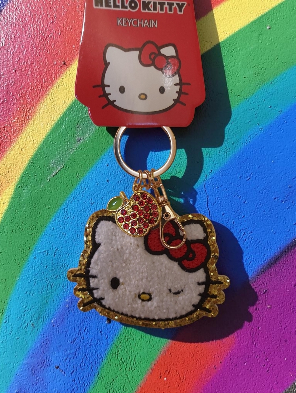 Sanrio Hello Kitty Winking Sherpa  Bag Charm Keychain with Rhinestone Apple